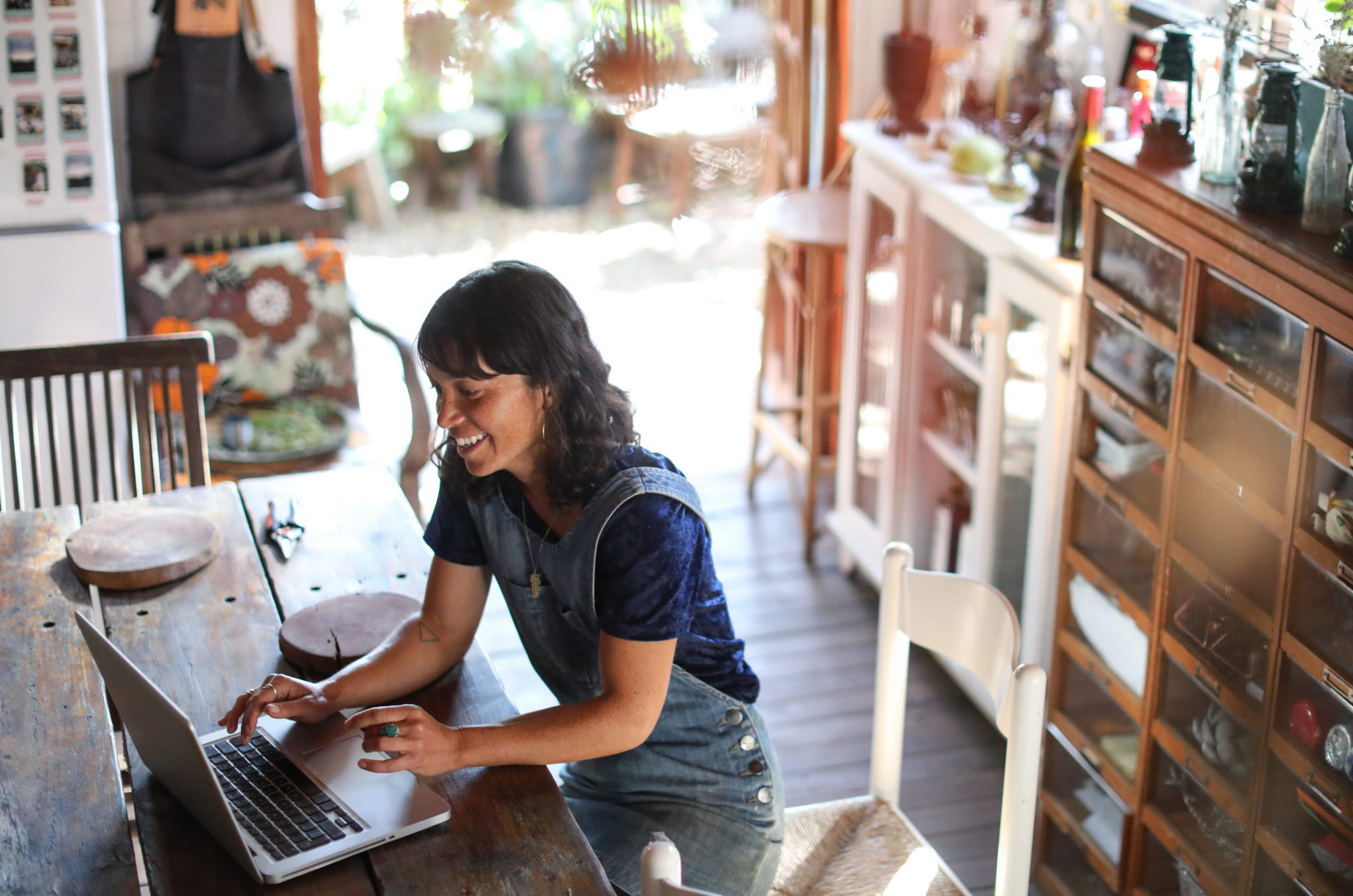 An image of a woman using her laptop for the international business payments guide.